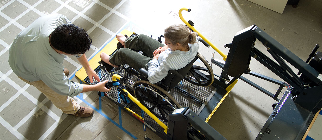 wheelchairuserliftstudy.jpg participant getting measure with a Faro arm in an anthropometry study